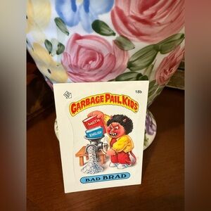 Garbage Pail Kids 'Bad Brad' Collectible Trading Card - Red/Yellow/Blue